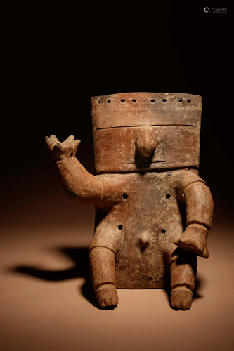 A Quimbaya Terracotta Seated Figure Height 10 1/2