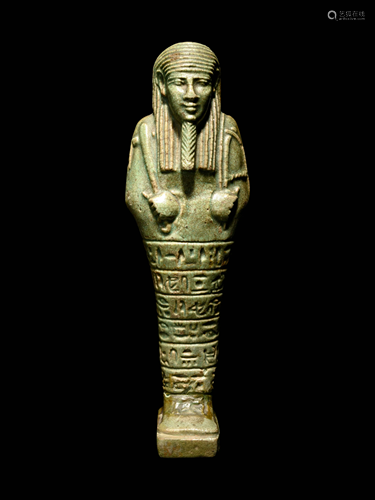 An Egyptian Green-Glazed Ushabti Height 7 inches.