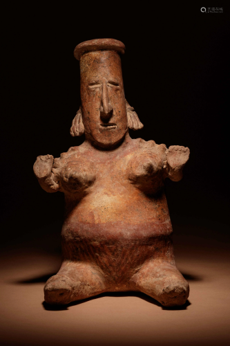 A Nayarit Terracotta Seated Female Figure Height 18 1/2