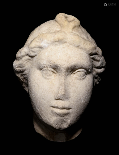 A Roman Marble Head of a Woman with Plaited Hair and