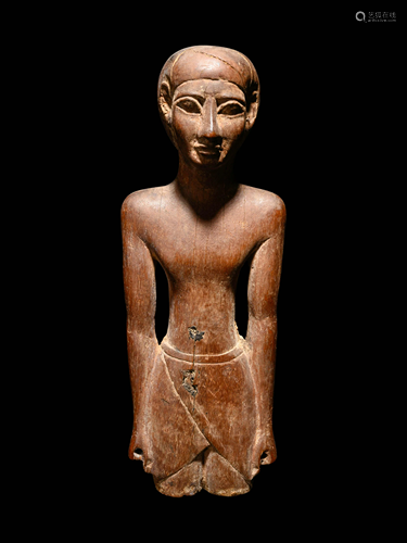 An Egyptian Wooden Male Figure Height 9 inches.