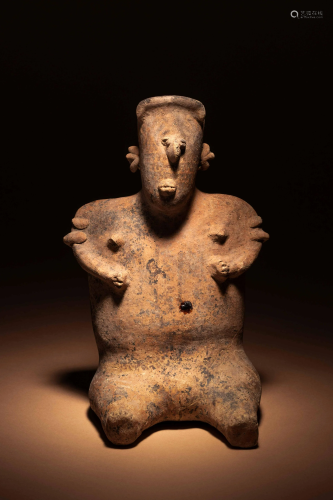 A Nayarit Terracotta Seated Female Figure Height 10 3/4