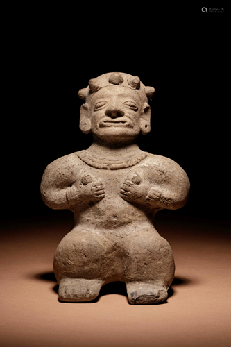 A Tumaco Female Figure Holding Breasts Height 7 1/4