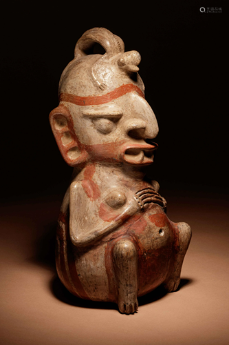 A Nicoya Polychrome Terracotta Figure Height 15 inches.