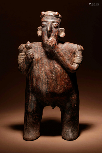 A Nayarit Standing Male Figure Height 18 1/2 inches.