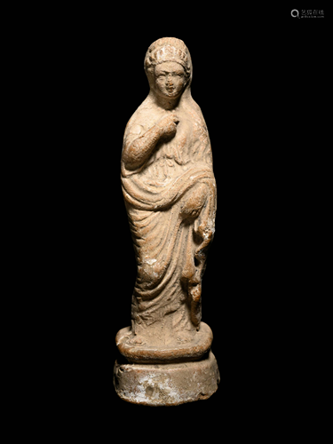 A Greek Terracotta Figure of a Young Woman Height 4 1/4