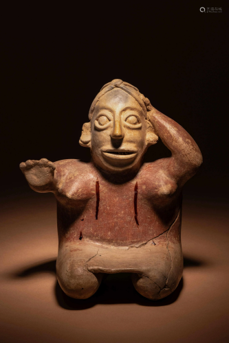 A Jalisco Terracotta Seated Figures Height of taller 10