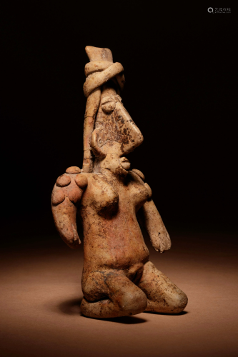 A Jalisco Terracotta Kneeling Figure Height 5 3/4