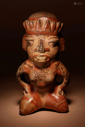 A Nicoya Polychrome Terracotta Seated Figure Height 11