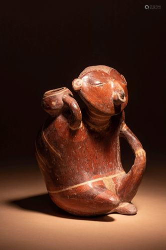 A Nayarit Terracotta Seated Figure Height 10 1/2