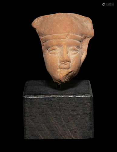 An Egyptian Terracotta Head of Horus Height 1 1/4