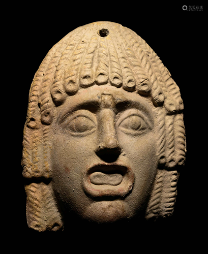 A Roman Terracotta Theater Mask Height 4 3/4 inches.