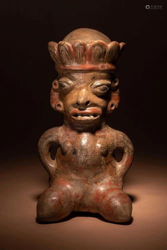 A Nicoya Polychrome Terracotta Seated Figure Height 14