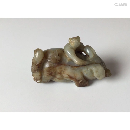 A Chinese Carved Jade Figure of Little Child on