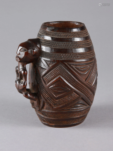 A Kuba Cup with a Figure as Handle