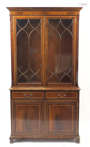 Inlaid mahogany book case fitted with a pair of glazed