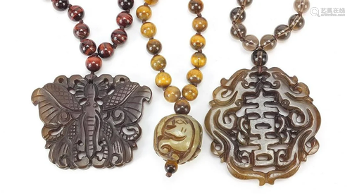 Three Chinese carved hardstone pendant bead necklaces,