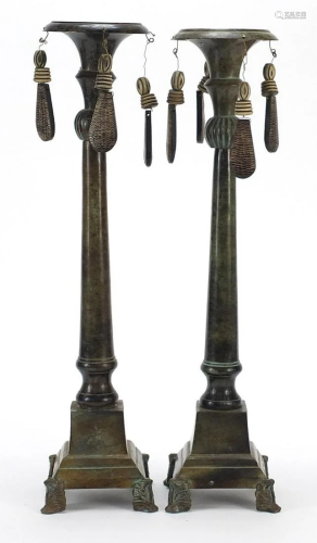 Pair of Middle Eastern bronzed candlesticks with horn