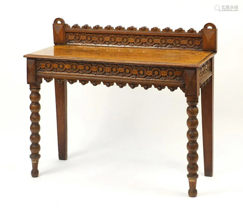 Victorian gothic style carved oak side table with