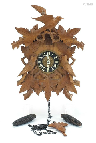 Carved Black Forest cuckoo clock with weights and