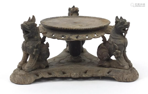 Burmese hardwood stand carved with three dragons,