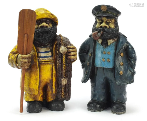 Two hand painted figures in the form of a fisherman and