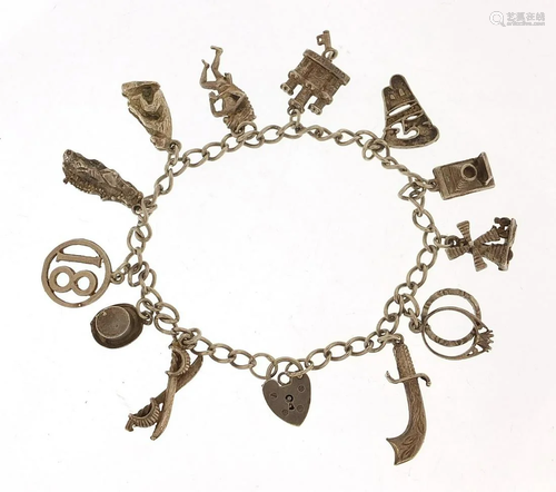 Silver charm bracelet with a selection of charms