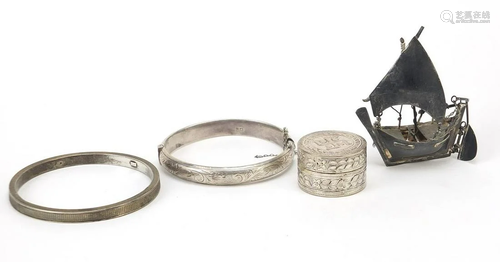 Two silver bangles, a silver coloured metal model junk