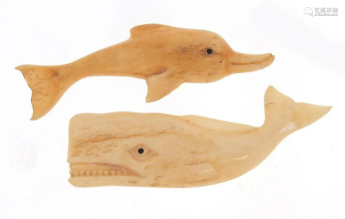 Two Scrimshaw style bone carvings of a whale and
