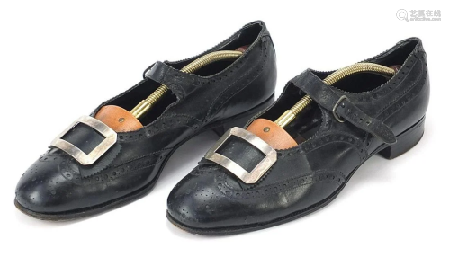Pair of vintage black leather shoes with unmarked