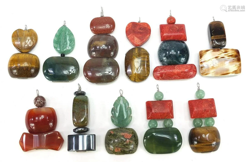 Eleven polished stone pendants including cat's eye,