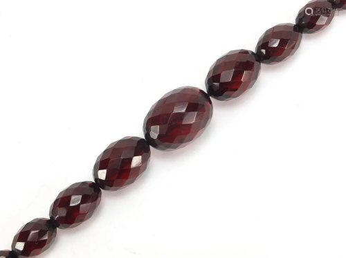 Cherry amber coloured facetted bead graduated necklace,