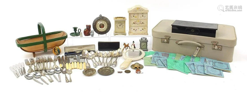 Sundry items arranged in a vintage suitcase including