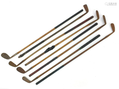 Eight wooden shafted golf clubs including Special