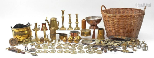 Collection of metalware arranged in a wicker basket