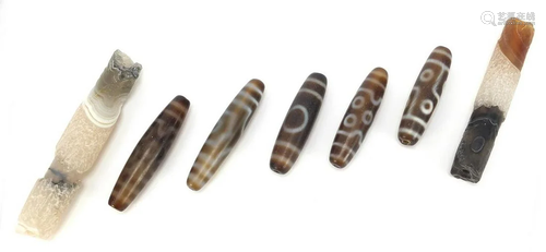 Seven Tibetan agate beads, the largest 10cm in length