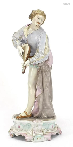 Continental porcelain figure of a gentleman playing a