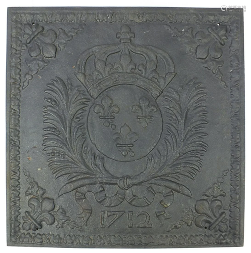 Cast iron fire back with coat of arms dated 1712