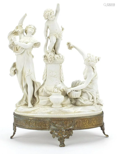 Continental Parian figure group with ornate bronzed