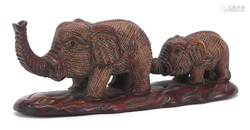 Japanese carved wood okimono of two elephants, inset