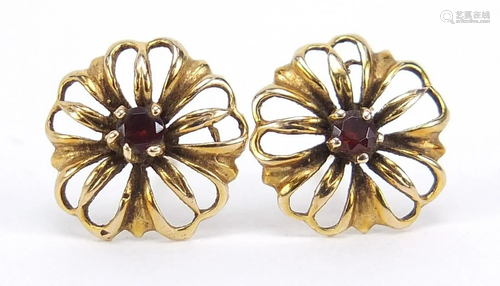 Pair of 9ct gold garnet flower head stud earrings,