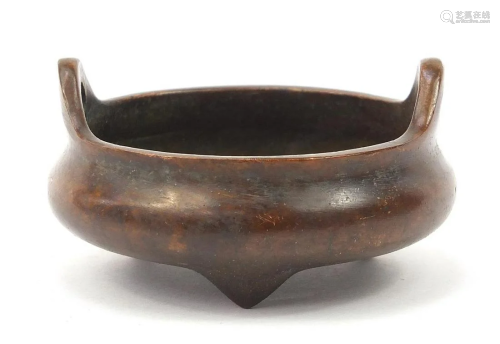 Chinese patinated bronze tripod censer with twin
