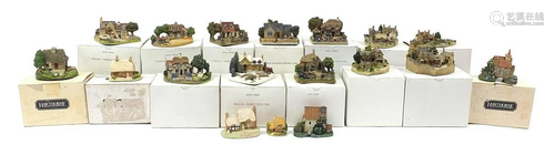 Collection of model cottages with boxes including