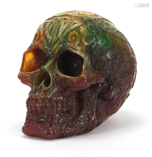Amber coloured marbleised skull, 18cm in length