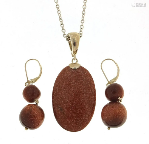 Silver goldstone pendant on a silver necklace with