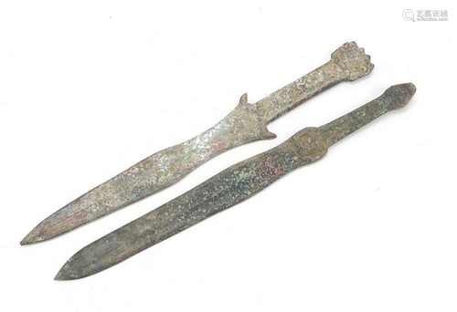 Two Chinese/Islamic patinated bronze short swords, the