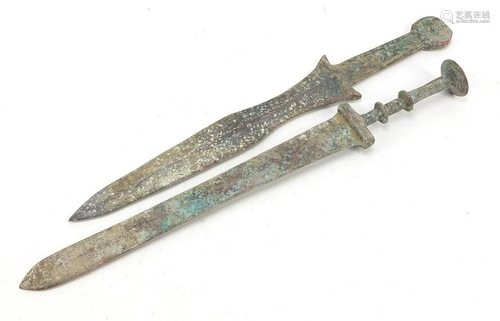 Two Chinese/Islamic patinated bronze short swords, the