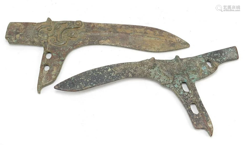 Two Chinese/Islamic patinated bronze axe heads, the