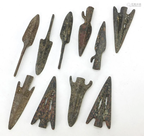 Ten patinated bronze arrow heads, the largest