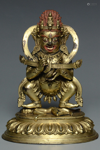 AN INSCRIBED MING DYNASTY GILT BRONZE MAHAKALA